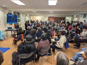 People gather at a meeting